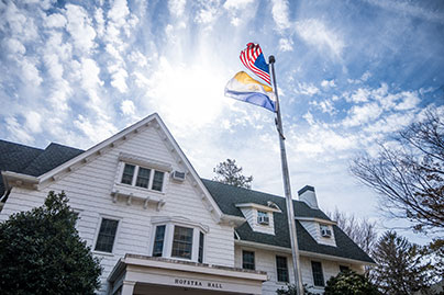 A white building with a flag in front. Links to Gifts by Will will.jpg