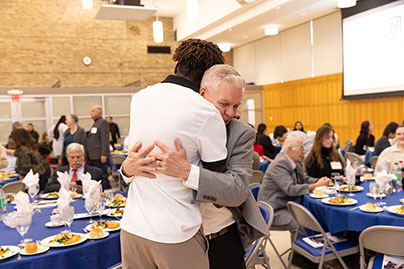 Two people hugging. Links to Gifts of Appreciated Securities securities.jpg